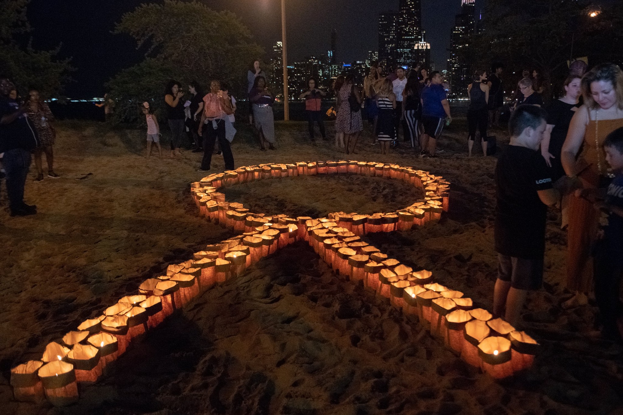 Lighted vigil in the shape of a ribbon