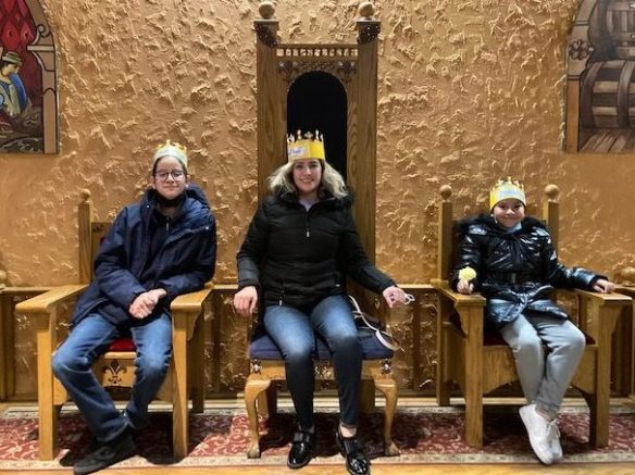 3 event participants sitting on throne seats